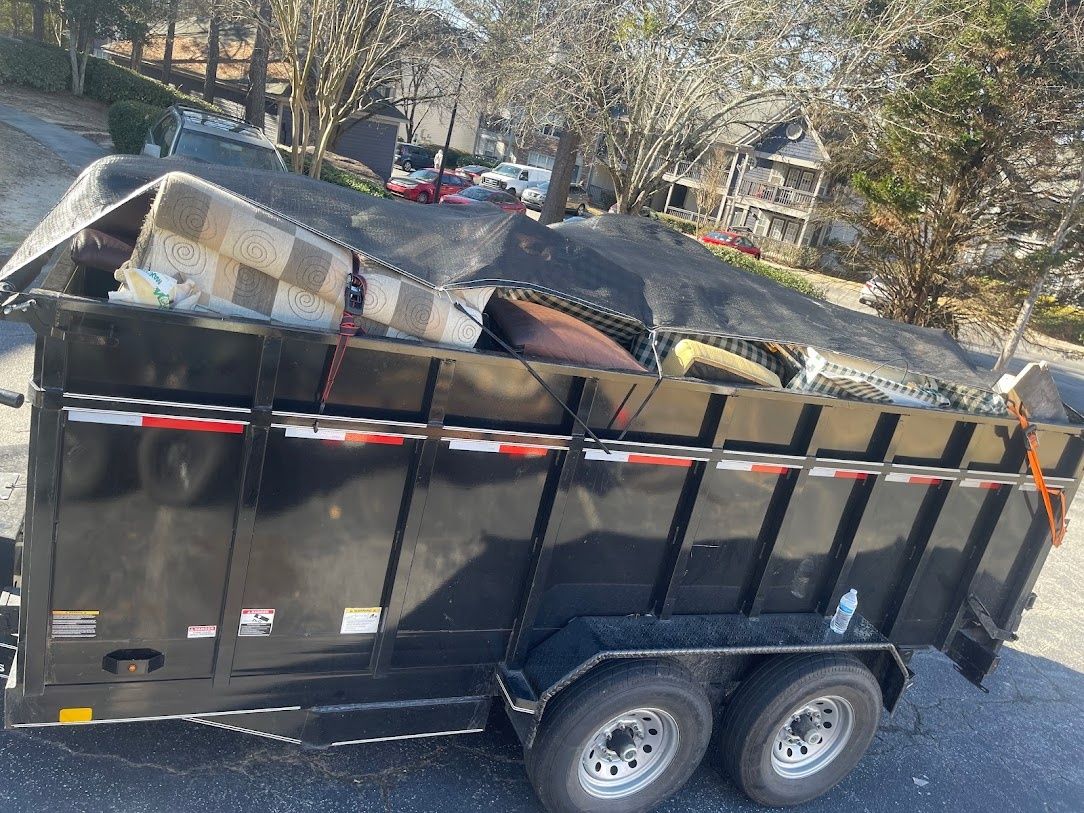 Wakanda Junk Removal crew hauling junk in Atlanta, GA